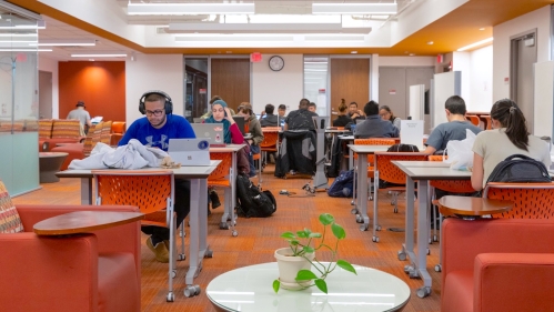 Students sit at desks and study in the Learning Centers