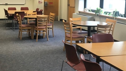 Empty tables in a study space in the Cook campus learning center.