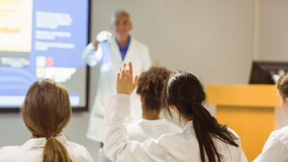 Medical school students listen to a lecture